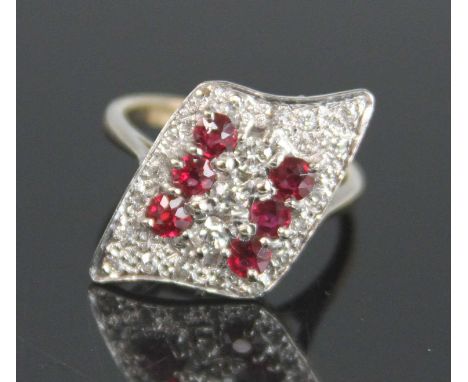 A yellow and white metal, ruby and diamond abstract navette shaped cluster ring, featuring two rows of three round rubies dia