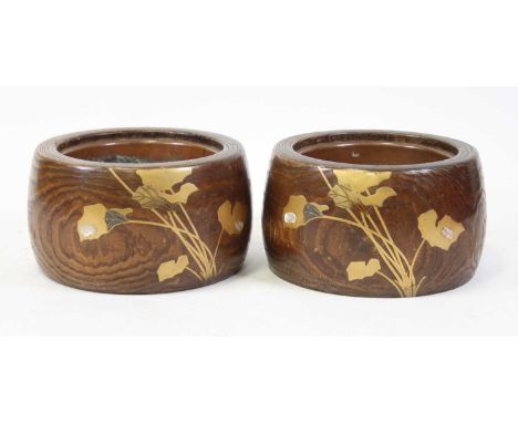 A pair of Japanese Taisho Period (1912-26) elm hibachi, each of cylindrical form, being metal lined, the exteriors with gilt 
