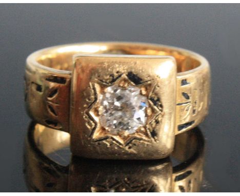 A late 19th century yellow metal and diamond memorial ring, featuring an Old European cut diamond star set within a square he