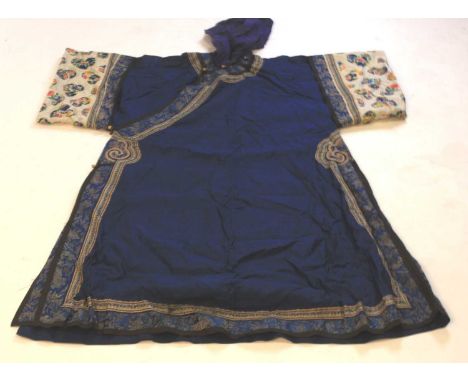 A late 19th / early 20th century Chinese long summer gauze robe, in deep blue open weave patterned with medallions, having de