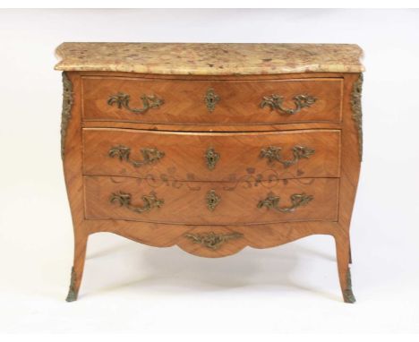 A Louis XV style kingwood marble topped bombe commode, having three long drawers, two with scroll flower marquetry inlays, al