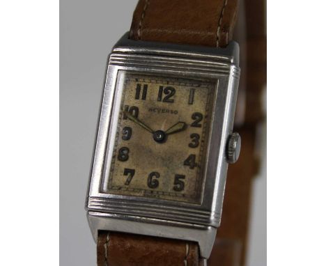 A gent's 1930s steel cased Reverso wristwatch, having a tank dial signed Reverso and with luminous Arabic numerals, Lisica ma
