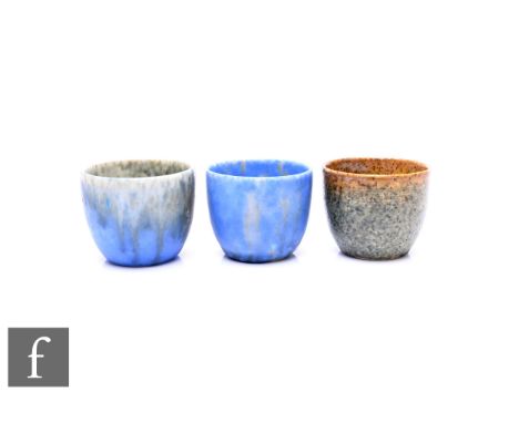 Ruskin Pottery - Three crystalline egg cups, circa 1930, graded ivory to blue, mottled blue and mottled ochre to grey/green g