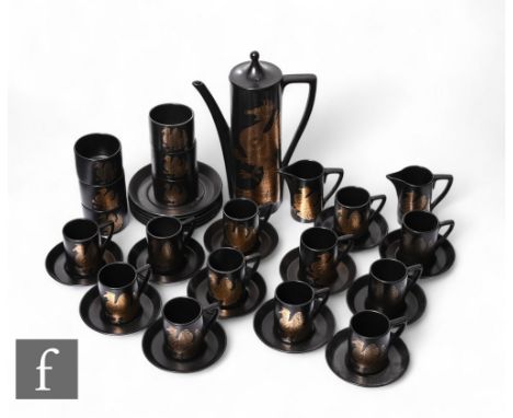 John Cuffley - Portmeirion Pottery - A 'Phoenix' pattern coffee set, gold stylised birds over black ground, comprising coffee