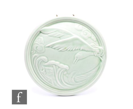 William S Mycock - Pilkington's Royal Lancastrian - A relief moulded wall plaque, of circular form, decorated with a seagull 