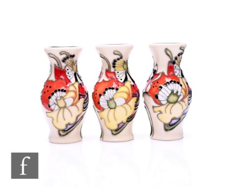 Emma Bossons - Moorcroft Pottery - Three 'Demeter' miniature vases, of baluster form, tube line decorated with stylised flowe