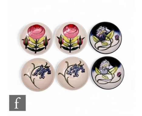 Nicola Slaney - Moorcroft Pottery - A pair of 'Trefoil' pin dishes, circa 2015, circular form, tube line decorated with clove