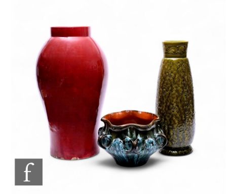 Christopher Dresser - Linthorpe Pottery - An art pottery jardiniere, of circular dimpled form, with six conjoined loop handle