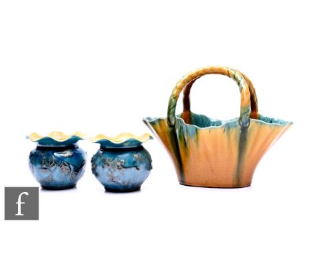 Linthorpe Pottery - A twin handled basket, shape no.1788, of flared form with wavy rim and conjoined moulded rope twist handl