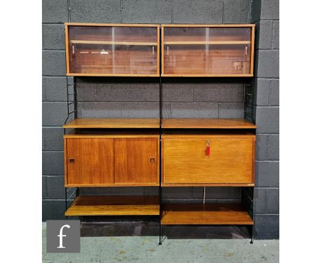 Robert Heal - Staples &amp; Co Ltd - A teak Ladderax modular system on black steel supports, to include two sliding glazed do