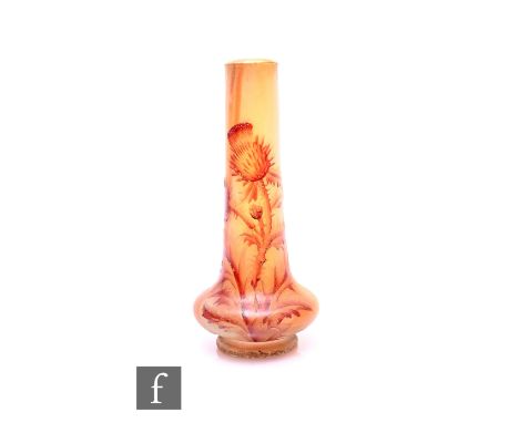 Attributed to Daum - Nancy - A miniature cameo glass vase of low shouldered form with a tall slender neck, cameo cased over a