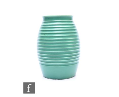 Keith Murray - Wedgwood - An Art Deco 'grenade' vase, circa 1930, of finely ribbed ovoid form with matt green glaze, printed 