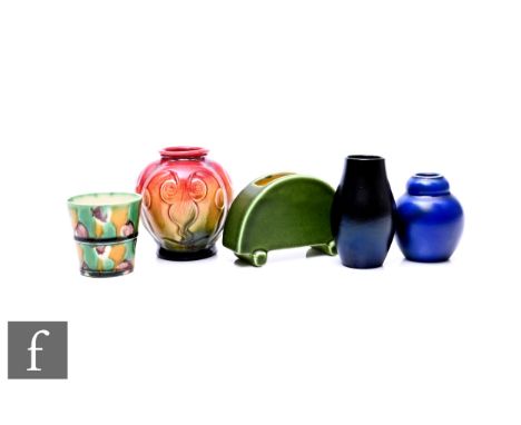 Ault Pottery - An early 20th Century vase, of quarter lobed form with molded stylized orchids, graded red to lemon and green 