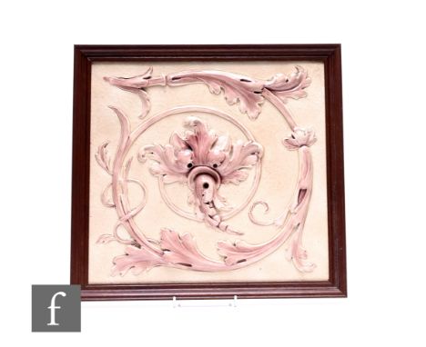 Burmantofts Faience - A large plastic clay tile, circa 1880, high relief moulded acantus foliate scrolls with graded aubergin