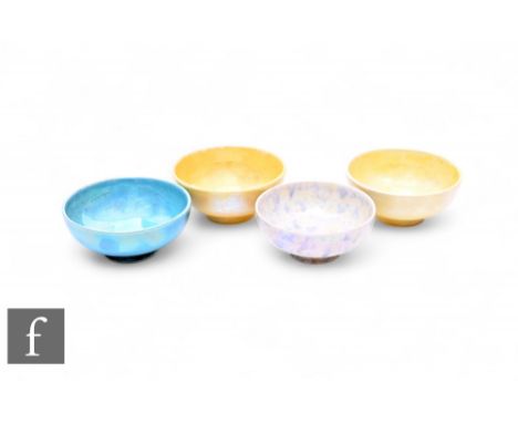 Ruskin Pottery - Four lustre salts, circa 1920, each of circular footed form, yellow, blue and mottled grey/lemon glazed exam