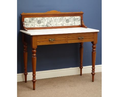 Late Victorian walnut two drawer wash stand, white marble top and raised wildlife tile splash back, turned supports, W102cm, 