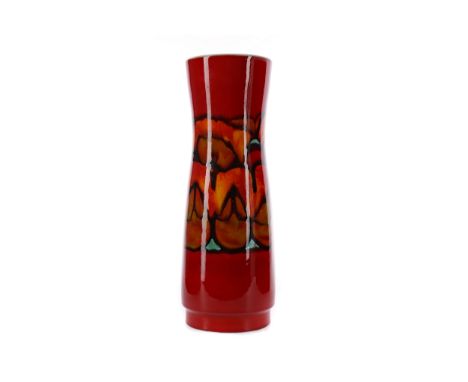 POOLE POTTERY DELPHIS VASE, of waisted cylindrical form, decorated in a flambe glaze with an abstract band on a red ground, p