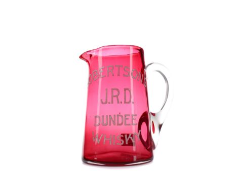 LATE VICTORIAN CRANBERRY GLASS WATER JUG, of tapering cylindrical form with clear glass hoop handle, the body inscribed Rober