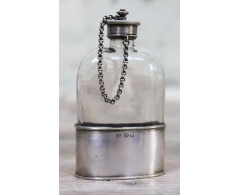 A silver plated and glass hip flask with screw on top, height 11cm.