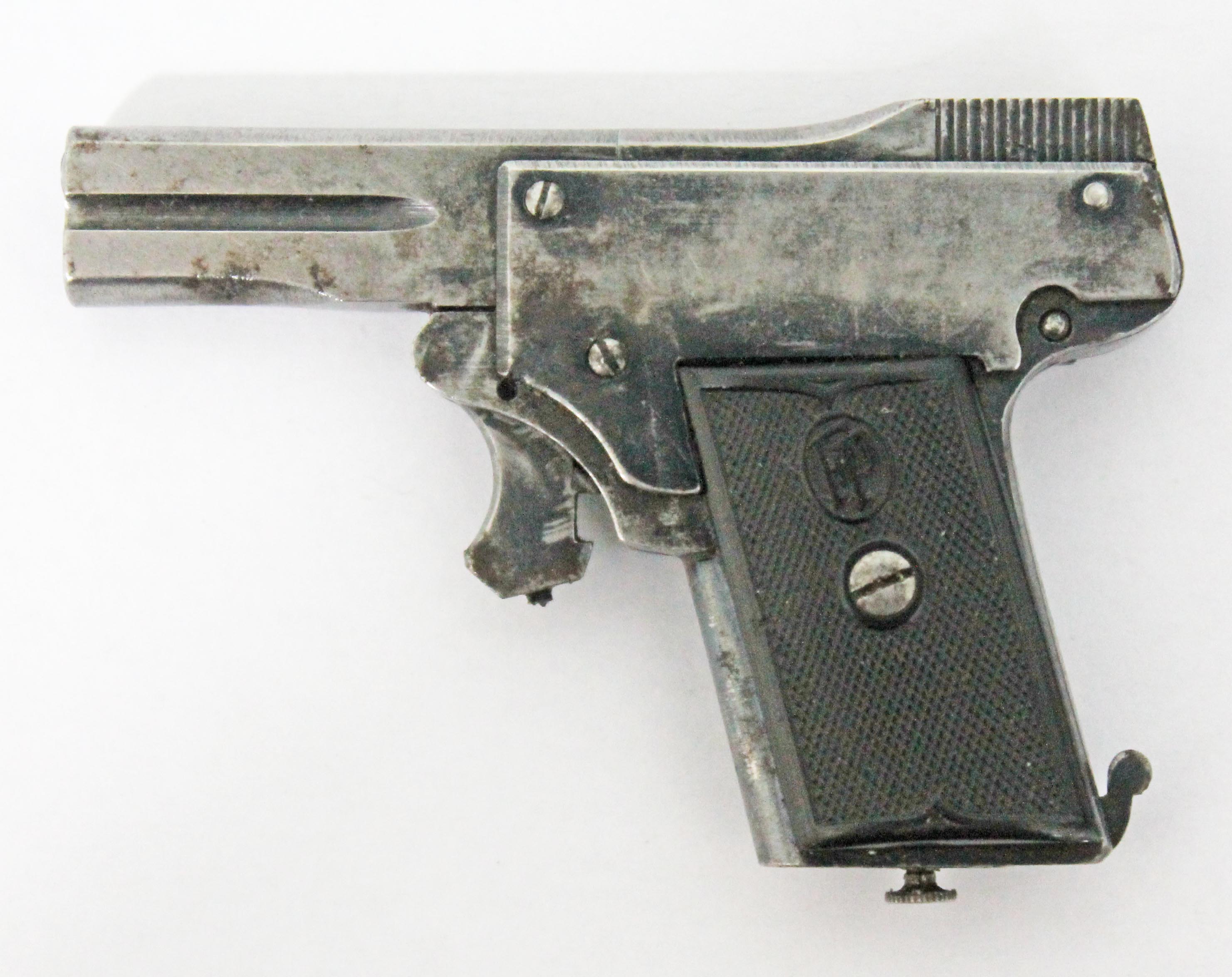 A Kolibri 2.7mm miniature semi automatic pistol.