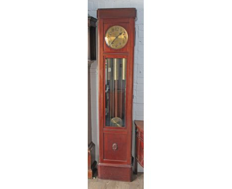 A mahogany longcase clock circa 1920 with brass dial having Gothic numerals, Westminster chime movement, bevelled glass door,