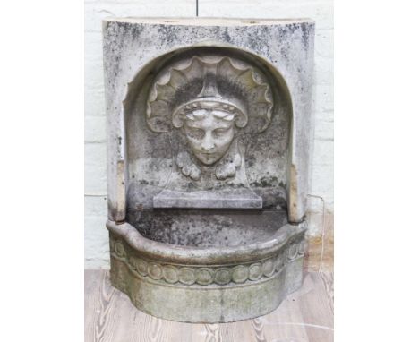 A 19th Century wall mounting earthenware fountain head and basin, width 61cm, depth 36cm &amp; height 83cm.
