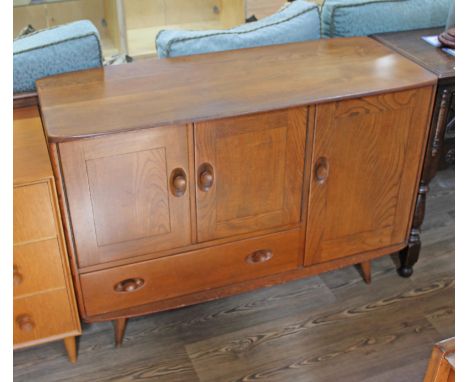 An Ercol elm sideboard, length 114cm, depth 49cm & height 81cm.