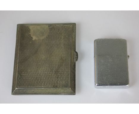 A George V silver cigarette case, maker Cohen & Charles, Chester 1919, together with a Zippo lighter, 2.5oz