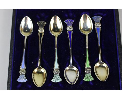 A cased set of six Norwegian silver gilt and enamel coffee spoons the harlequin enamel thistle design, by Jacob Tostrup