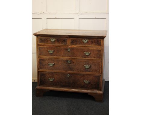 An 18th century walnut and burr yew chest of two cross banded short drawers over three long drawers, on bracket base, (a/f), 