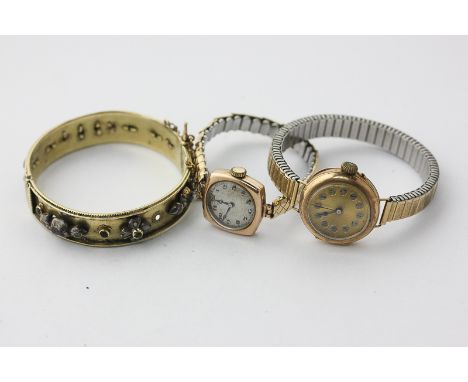 Two lady's 9ct gold wristwatches on gilt bracelets, and a gilt and gem set bangle