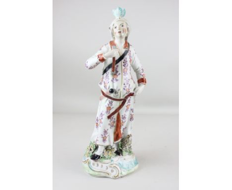 A Derby figure of Diana holding an arrow in one raised hand, a quiver slung over her shoulder, on shaped scroll base, 33cm hi