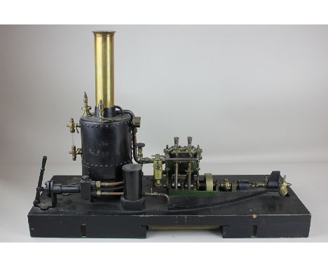 A portable model steam boat engine mounted on wood base, 37cm high (including base) by 51cm wide
