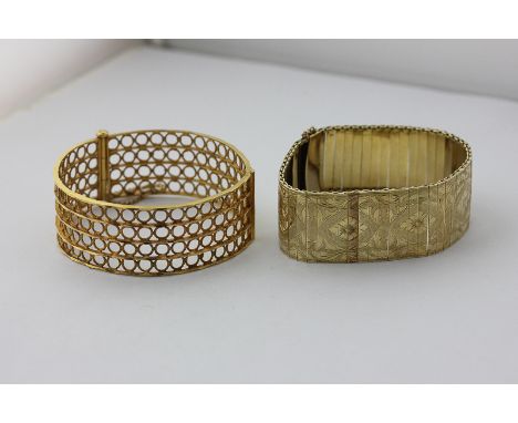 A 14ct gold foliate engraved bracelet, 29.5g, and a gold hinged bangle, 38.2g
