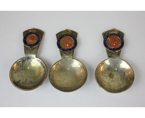 Three silver plated Naval caddy spoons bearing crests of RMS Queen Mary, RMS Queen Mary, RMS Ascania and MV Britannic