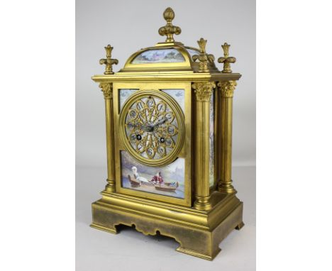 A late 19th century French gilt metal mantel clock, rectangular form with domed top and pineapple finial, decorated with pain