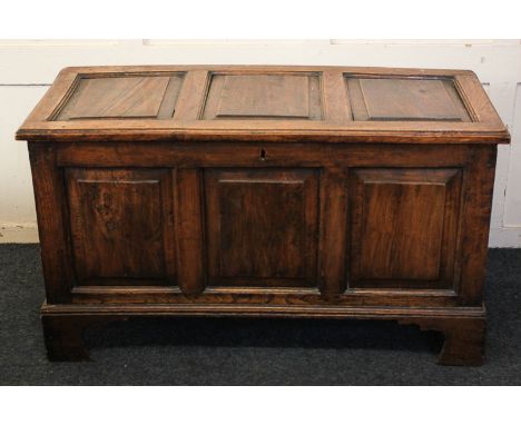 An 18th century three-panel oak coffer on bracket feet, 108cm