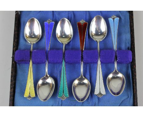 A cased set of six Norwegian silver gilt and enamel coffee spoons with harlequin enamel handles by David Andersen