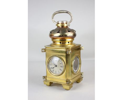 An unusual brass lantern table clock/barometer with carry handle, inset with compass, barometer and two thermometers, 25cm hi