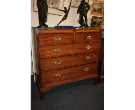 An early 19th century mahogany chest of two short over three long drawers, with satinwood inlaid frieze and ebony line edging