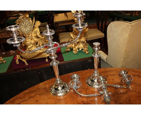 A pair of silver plated three light candelabra with two scroll branches, vase sconces, on baluster stems (one a/f), 49cm high