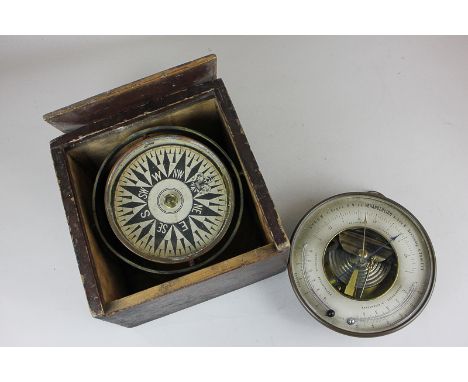 A German barometer by Veranderlich, in circular brass case, with loop handle, 17cm, and a cased compass with gimballed action