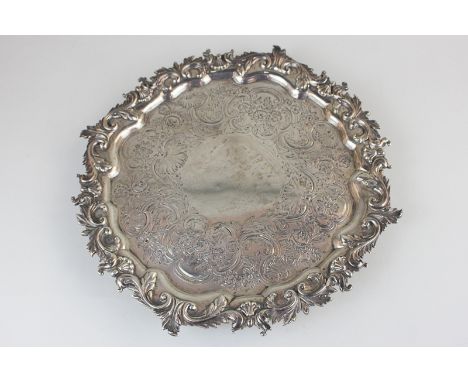 A George IV silver salver, maker Paul Storr, London 1823, with floral scroll border and chased decoration, 21.5oz