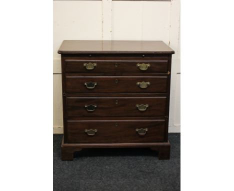 A George III mahogany small chest of four drawers with brushing slide, on bracket feet, 76cm,  (a/f)