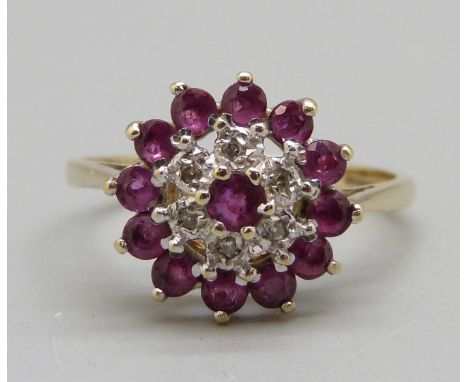 A 9ct gold, ruby and diamond cluster ring, 2.4g, O 