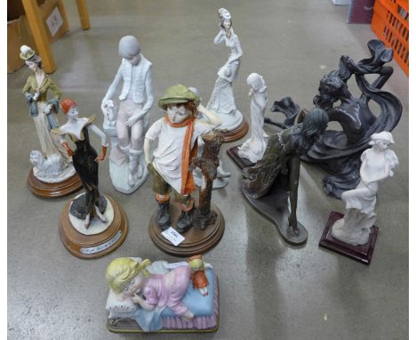 A collection of decorative figures including Art Deco style and a musical child figure **PLEASE NOTE THIS LOT IS NOT ELIGIBLE