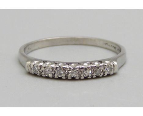 A seven stone diamond ring, marked .900 plat, 2.7g, O 