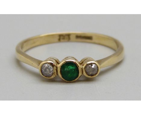 An 18ct gold, emerald and diamond three stone ring, circa 1920's, 2.3g, Q 