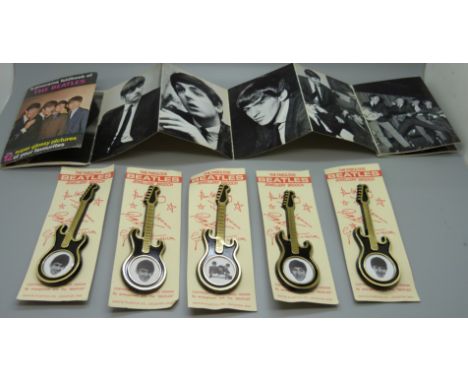 Five The Beatles Invicta Plastics guitar brooches and a Beatles Pixerama book 