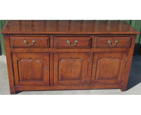 C18th style oak dresser, moulded top above three fielded panel drawers and three similar doors, on stile feet, W153 D48cm H82